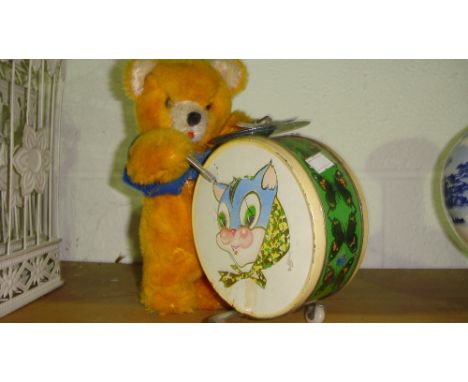 Vintage clockwork teddy bear drummer