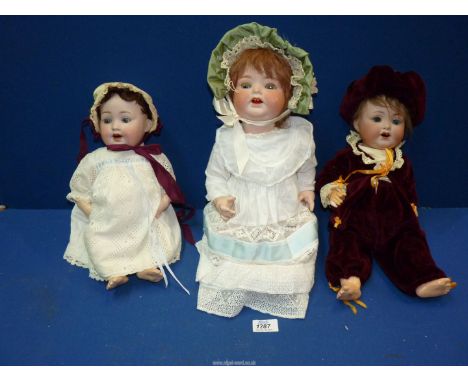 Three German Bisque character Dolls in period costume including an Armand doll.