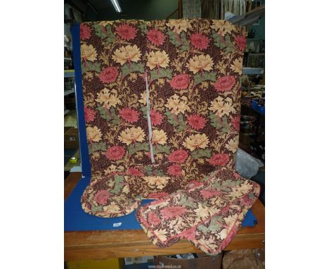 A pair of pinch pleat Curtains with detachable linings in pink and rich cream coloured blooms on a brown background with ligh