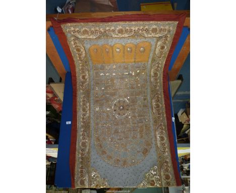 A Burmese Kalaga Buddha's foot Tapestry circa 1900 woven in metal threads with sequin inclusions, 35" x 66" approx.