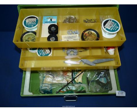 A fishing Tackle Box and contents to include, reel, hooks, weights, etc.