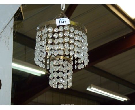 A two tier glass button light fitting.