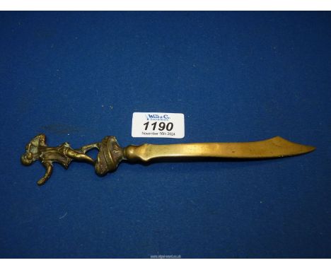 A collectible Peter Pan souvenir brass Letter Opener, early 20th century, the finial depicting Peter with his flute, the open