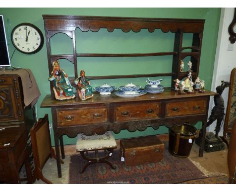 A fine old Welsh Dresser having three frieze drawers with unusual inlaid details, a scalloped edged apron and complete with a