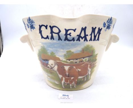 An unmarked ceramic dairy Pail labelled "Cream" with a farmyard scene, 11" diameter x 8" tall.