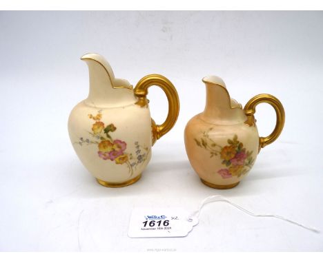 Two small Royal Worcester Jugs, design No 1094 different production dates with floral decoration and gilded handles bases and