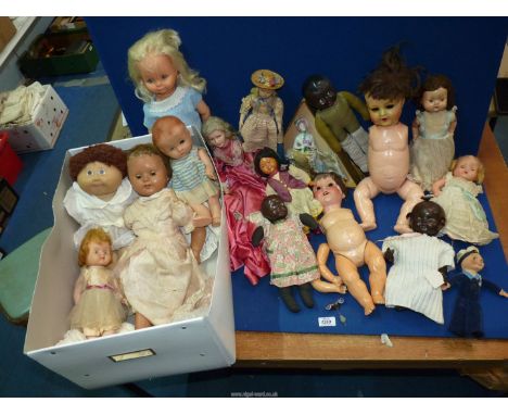 A large quantity of 20th century dolls to include: two Armand Marseille dolls (in need of restoration), porcelain doll with l