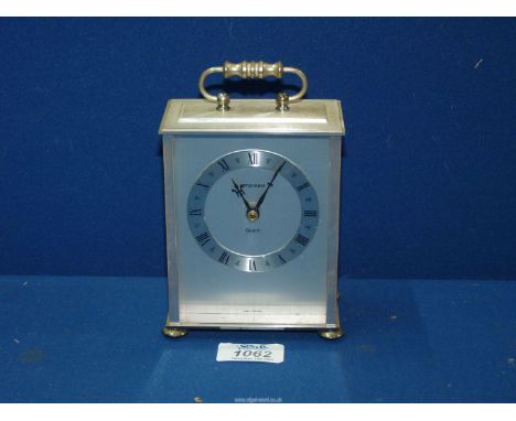 A "Staeger" quartz carriage clock with brushed steel case.