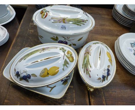 A large Royal Worcester Evesham casserole dish and lid, two tureens and lids and a serving dish.
