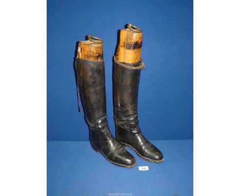 A pair of ladies black leather Hunting Boots with wooden trees.