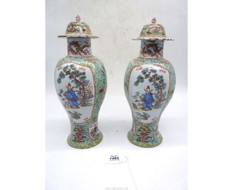 An impressive pair of covered Delft Vases painted in petit feu colours with oriental figures against a floral ground, marked 