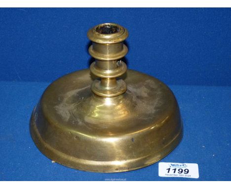 A rare mid-16th century Flemish brass Candlestick, standing on a broad base, the column with protuding knops, the socket with