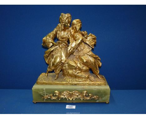 An attractive art deco gilt Bronze figure group of Oriental Lovers on an onyx base with ormolu mounts, 1920's, 13'' wide x 5'