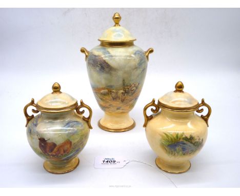 A Garniture of three lidded Urns; the largest one hand-painted with a flock of sheep in a rugged landscape, the two smaller o