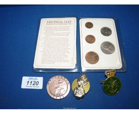 A George III 1797 cartwheel Penny and a First Decimal Coins wallet and two badges.