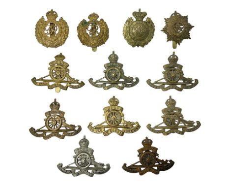 Twelve cap badges including Royal Artillery, 3rd RGA Middlesex Volunteers, Hon. Artillery Company, West Riding and Waraickshi