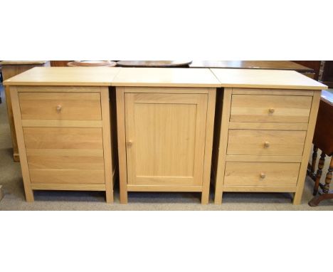 Modern light oak chest of three drawers, a similar single door cupboard and a similar chest of two drawers   Condition: 