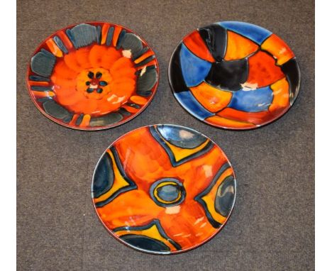 Three modern Poole pottery dishes, each with typical stylised decoration   Condition: 