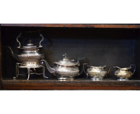 Silver plated three piece tea service having fluted decoration together with a similar spirit kettle   Condition: 