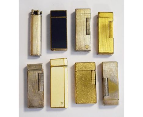 Six vintage Dunhill cigarette lighters together with two Cartier cigarette lighters   Condition: 