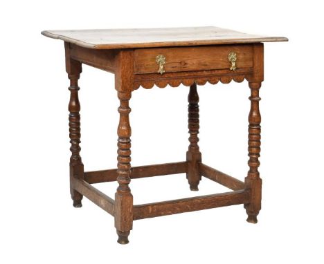 18th Century oak rectangular top side table fitted one long drawer, shaped frieze below and standing on bobbin turned support