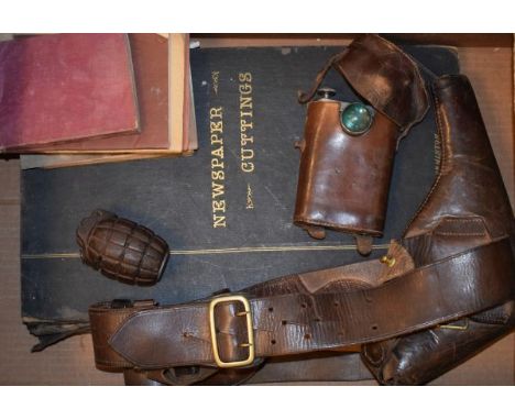 Small collection of World War I memorabilia comprising: leather Sam Browne belt, Orilux single lamp in leather case, hand gre