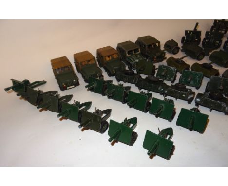 Britains set 2102 Austin Champ limbers and 25pdr guns by Britains and Crescent sixteen Britains 25pdrs, ten regulation limber