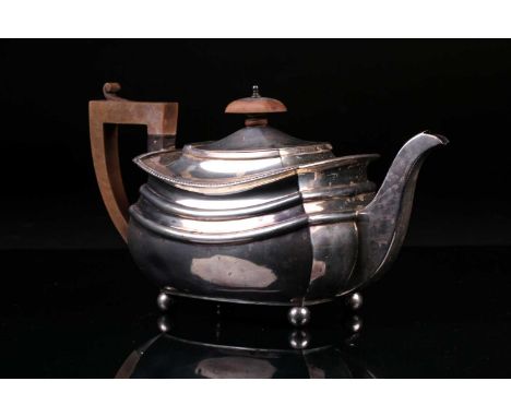 A George V silver teapot, Chester 1933 by S. Blanckensee &amp; Sons Ltd, of rectangular form on four ball feet, 27 cm wide x 