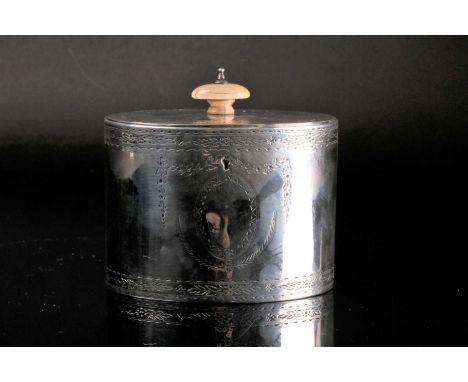 A Victorian silver oval tea caddy by Joseph Angell II, with ivory knop, with bright cut swags and vacant cartouches to either