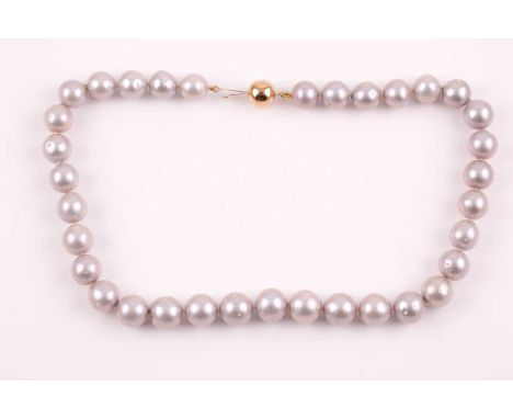 A pale grey freshwater pearl necklace, suspended with rounded silvery grey pearls, approximately 12 mm diameter, fastened wit