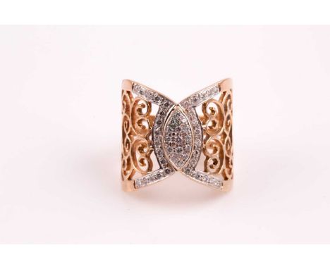 A diamond dress ring; the central scroll engraved plaque with a marquise shaped pave set diamond centre and diamond set borde