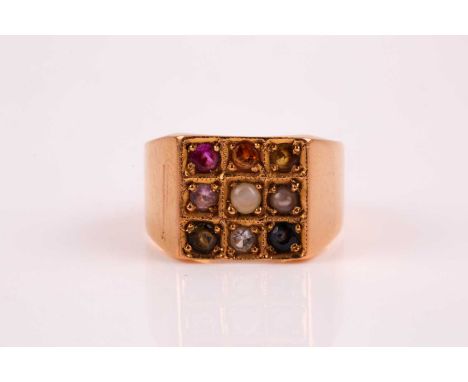 A multi gem set ring, the square cluster pave set with sapphires, pearl, topaz and tourmalines in an unmarked wide tapering y