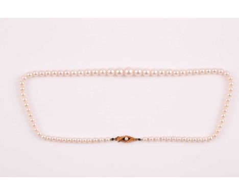 A graduated cultured pearl necklace, the pearls measuring approximately 4.5 - 9 mm, fastened with an 18ct yellow gold and pea