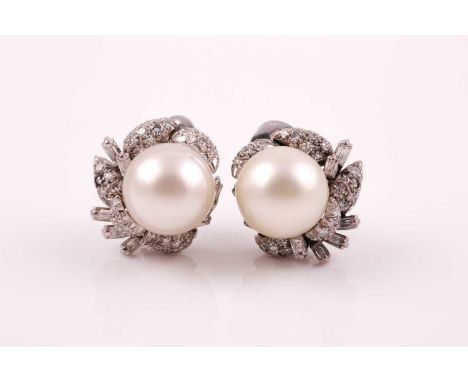 A pair of diamond and pearl cluster earrings, each set with a South Sea pearl approximately 11 mm diameter, within a diamond 