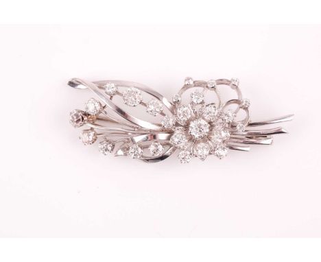 An old-cut diamond floral spray brooch, set with twenty six mixed old round-cut diamonds, the largest central diamond approxi