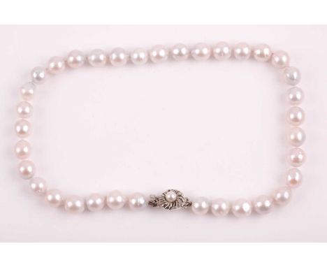 A South Sea white pearl necklace, the pearls approximately 9-11mm, fastened with a silver clasp, 41 cm long.