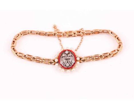 A late 19th / early 20th century yellow metal bracelet, set with a central oval segment, the trefoil design inset with old-cu