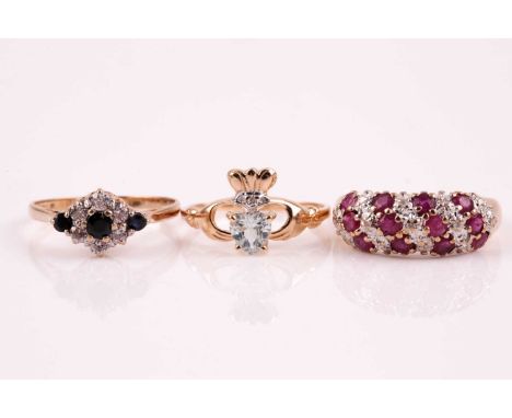 A three row half hoop ruby and diamond ring, the slightly curved band of circular cut rubies and single cut diamonds, 9ct yel