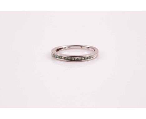 A half hoop diamond eternity ring, the princess cut diamonds in channel setting to white metal band marked '14k'; Size M, 2.0