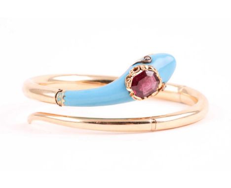 A yellow metal and turquoise enamel snake bangle, the bracelet terminal in the form of a snake head, with small diamond eyes,