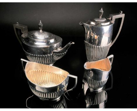 A matched four piece silver tea set, William Hutton &amp; Sons Ltd, London 1912 and Sheffield 1923/24, with part gadrooned an