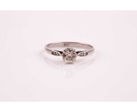 A single stone diamond ring; the old cushion cut diamond in eight claw mount, the shoulders each set with two mixed cut diamo