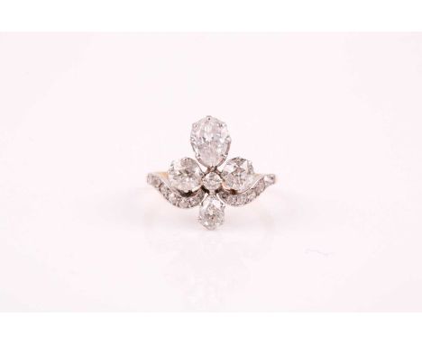 A late 19th / early 20th century diamond tiara ring, the quatrefoil design set with two pear-cut and three old round-cut diam