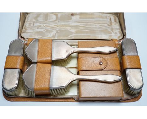 A cased 1950's engine turned silver mounted six piece mirror and brush set.