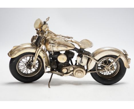 A late 1990's part silver miniature model of a Harley Davidson motor bike, Casa Julia International, London, 1997, length 23.