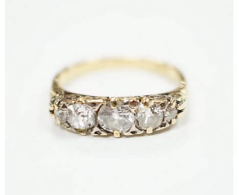 An 18ct and graduated five stone diamond set half hoop ring, size L, gross weight 2.8 grams (splits to setting).