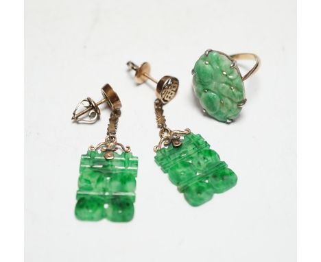 A pair of Chinese yellow metal and jade set drop earrings, 37mm and a yellow metal and carved oval jade set ring, gross weigh