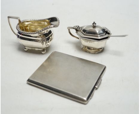 * * A George VI engine turned silver cigarette case, a silver lidded mustard pot and a small silver cream jug. Please note th