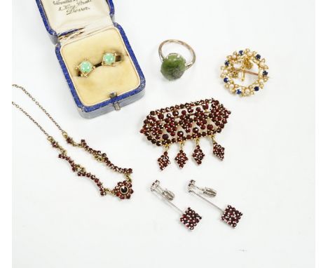 A yellow metal, sapphire and seed pearl cluster set openwork brooch, 23mm, a 9ct and hardstone ring, four items of garnet set