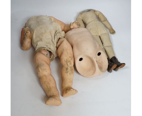A quantity of bisque doll heads, bodies and limbs